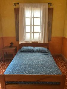 Hostel Iguana Azul tesisinde bir odada yatak veya yataklar