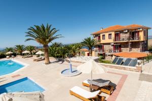 a villa with a swimming pool and a resort at Vida Balance Garden in Mythimna