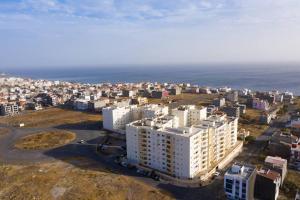an aerial view of a city with the ocean at 3 bedroom apt, Exterior POOL , Cidadela - LCGR in Praia