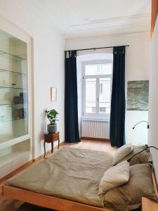 Ένα ή περισσότερα κρεβάτια σε δωμάτιο στο Larco Trieste studio living 3
