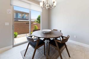 a dining room with a wooden table and chairs at A Vacation Vista home in Washington
