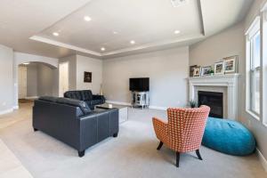 a living room with a couch and a chair and a fireplace at A Vacation Vista home in Washington +20 photos