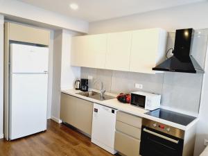 Kuchyň nebo kuchyňský kout v ubytování Otto Residences City Center 216
