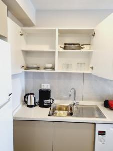 Kuchyň nebo kuchyňský kout v ubytování Otto Residences City Center 216
