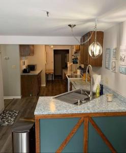 a kitchen with a sink and a counter top at Bring the Whole Family! in Sault Ste. Marie