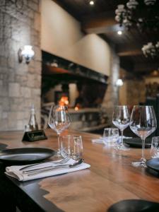 a group of wine glasses sitting on a table at Te'Dreri - Llogora Tourist Village in Dhërmi