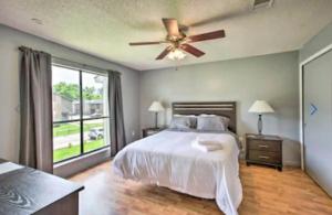 a bedroom with a bed and a ceiling fan at New! LSU Baton Rouge Contemporary 3 Bedroom Suite Condo in Baton Rouge