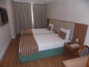 Кровать или кровати в номере Mirador Rio Copacabana Hotel