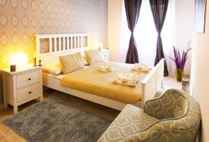 Posteľ alebo postele v izbe v ubytovaní Central Apartments