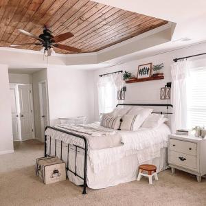 a bedroom with a bed with a ceiling fan at Charming 5 Bedroom spacious Home (sleeps 12-14) in Piedmont
