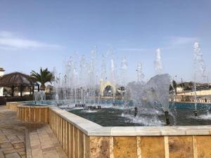 Una fuente en un parque con agua disparando en Majestic holiday home in Albox with private pool, en Albox