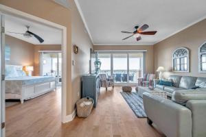 a living room with a couch and a bed at 3 bed 3 bath Waterfront Condo in Gated Community in St Pete Beach +44 photos