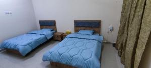 Postel nebo postele na pokoji v ubytování بيت الراحة Rest House