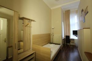 Postel nebo postele na pokoji v ubytování Hotel Elegia am Kurfürstendamm