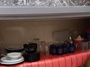 a counter top with plates and glasses on it at STAR APPARTEMENT GAUTHIER in Casablanca