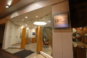a view of a store lobby with a sign on the wall at El Dorado Hotel in Cuenca +36 photos