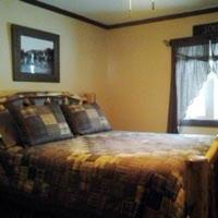 Postel nebo postele na pokoji v ubytování Deer Mountain Lodge & Wilderness Resort