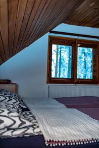 Letto o letti in una camera di Rustic Home Tara