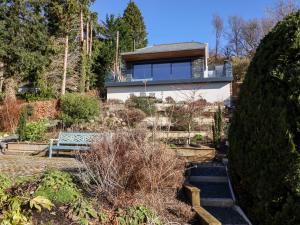 a house on top of a hill with a garden at Gillside in Keswick
