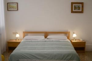Postel nebo postele na pokoji v ubytování Alloggi Barbaria