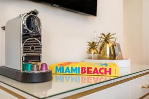 a book on a counter with a miami beach book at The Nici in Bournemouth