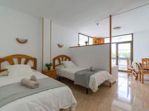 Posteľ alebo postele v izbe v ubytovaní Marlenghi Apartments 125