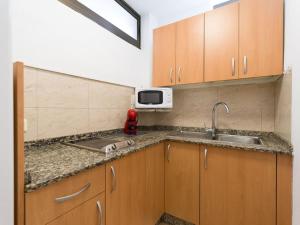 Kuchyňa alebo kuchynka v ubytovaní Marlenghi Apartments 125