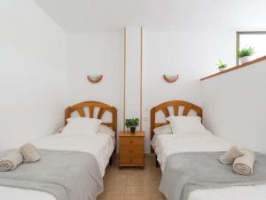 Posteľ alebo postele v izbe v ubytovaní Marlenghi Apartments 125