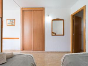 Posteľ alebo postele v izbe v ubytovaní Marlenghi Apartments 125