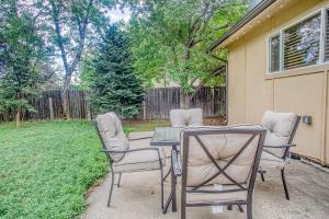a patio with a table and chairs in a yard at Dog Friendly 4BR2B Movie Area Denver Boulder in Arvada