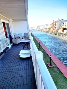 a balcony of a building with a view of the water at Spacious 2 Bedroom and 2 Baths in Ocean City