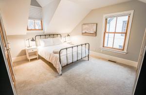 a bedroom with a bed and a window at The Irvine in Saint Paul