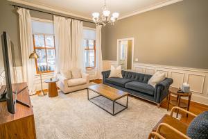 a living room with a couch and a table at The Irvine in Saint Paul