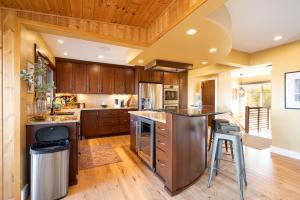 a kitchen with wooden cabinets and a wooden ceiling at The Lakeview in Red Wing