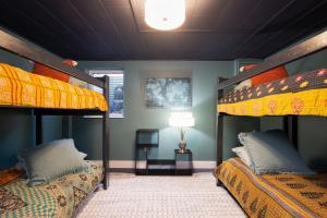 a room with two bunk beds and a lamp at The Lakeview in Red Wing