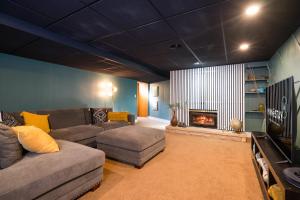 a living room with a couch and a fireplace at The Lakeview in Red Wing