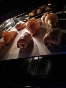 a group of pastries on a tray in an oven at Maison spa sauna in Morangis