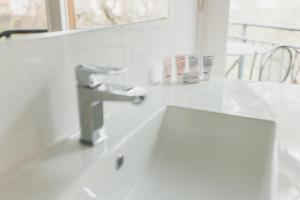 a bathroom with a sink and a mirror at The Mill Apartments Clare Valley in Clare