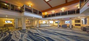 a lobby of a hospital with a large room with chairs at Grand Marquis Waterpark Hotel & Suites in Wisconsin Dells