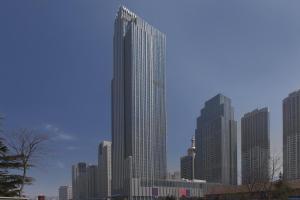 a tall building in a city with tall buildings at The Westin Qingdao - Instagrammable in Qingdao