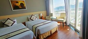 Postel nebo postele na pokoji v ubytování Dendro Gold Hotel