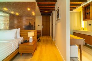 En eller flere senge i et værelse på Amber Boutique Silom