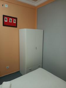 Postel nebo postele na pokoji v ubytování HOTEL BADINCA Alojamento Low Cost in Bissau avenida FRANCISCO MENDES