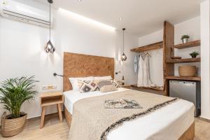 Postel nebo postele na pokoji v ubytování Galazia Boutique Apartments