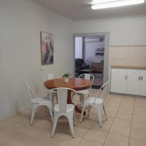 a kitchen and dining room with a table and chairs at Peterborough Motel in Peterborough