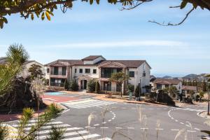 a street in a residential neighborhood with houses at ArdenHill Resort & Golf in Jeju