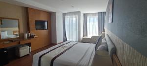 TV a/nebo společenská místnost v ubytování Dendro Gold Hotel