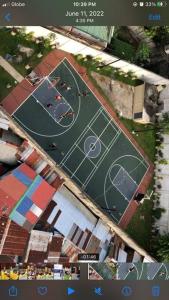 an overhead view of a tennis court in a city at Ellie’s Place in Cebu City