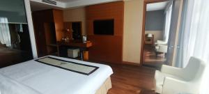Postel nebo postele na pokoji v ubytování Dendro Gold Hotel