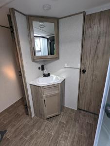 a bathroom with a sink and a mirror at H&K Acres in Rutland